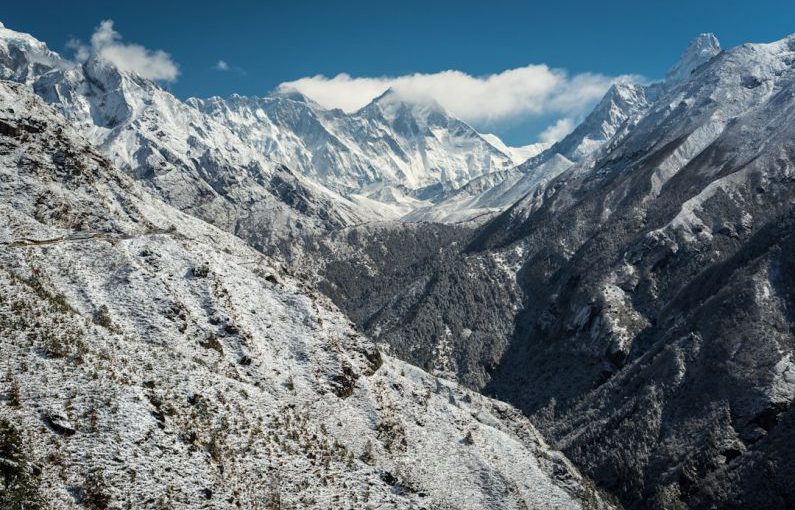 Everest Base - snow mountain with few white clouds