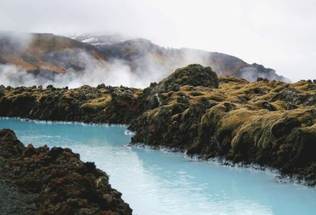 Blue Lagoon - landscape photography of river in the middle of mountains