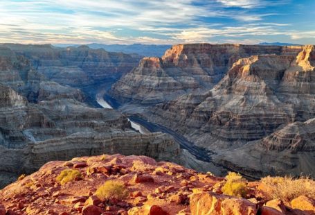 Grand Canyon - brown rocky mountain under white clouds during daytime