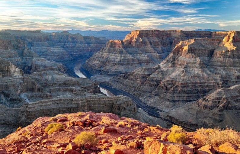 Grand Canyon - brown rocky mountain under white clouds during daytime