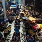 Floating Market - people riding on boat on river during daytime