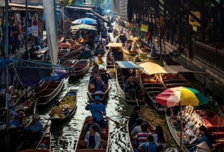 Floating Market - people riding on boat on river during daytime