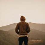 Bhutan Mountains - person wearing brown hoodie