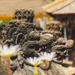 Bali Temple - two gray concrete dragon statues outdoor at daytime