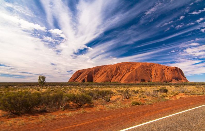 Uluru - landscape photography of mountain under blue sky