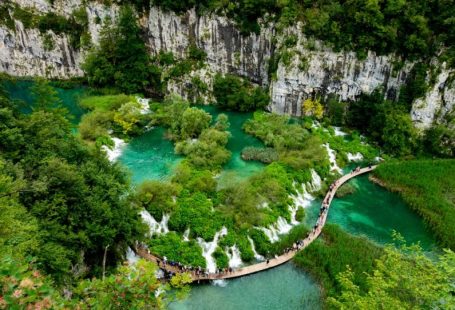 Plitvice Lakes - aerial view of river between rocky mountains during daytime