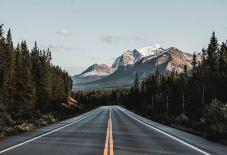 Canadian Rockies - wide road under blue sky