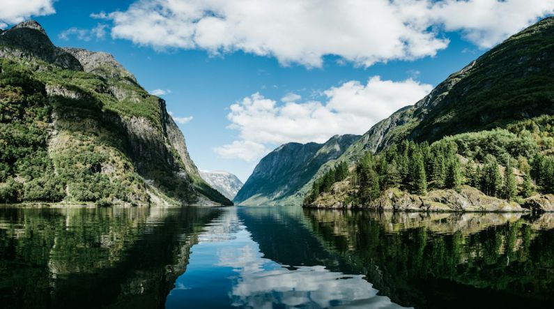 Norway Fjord - body of water near mountain under white clouds