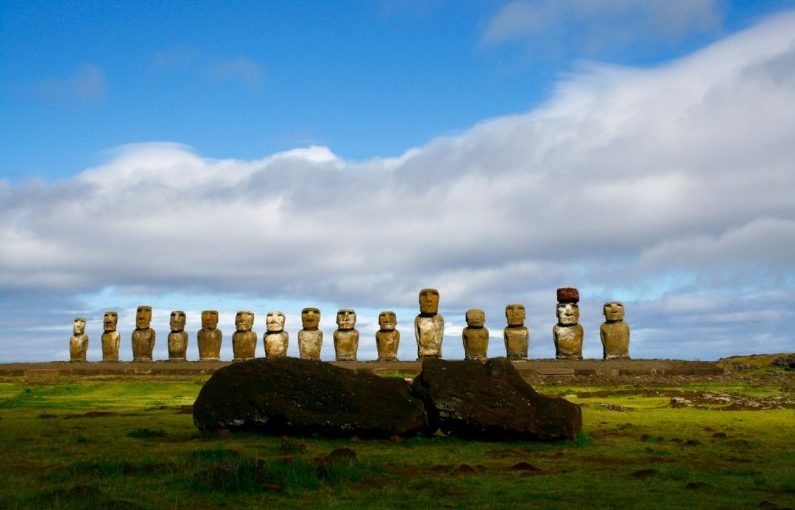Moai Statues - gray rock formation under white clouds and blue sky during daytime
